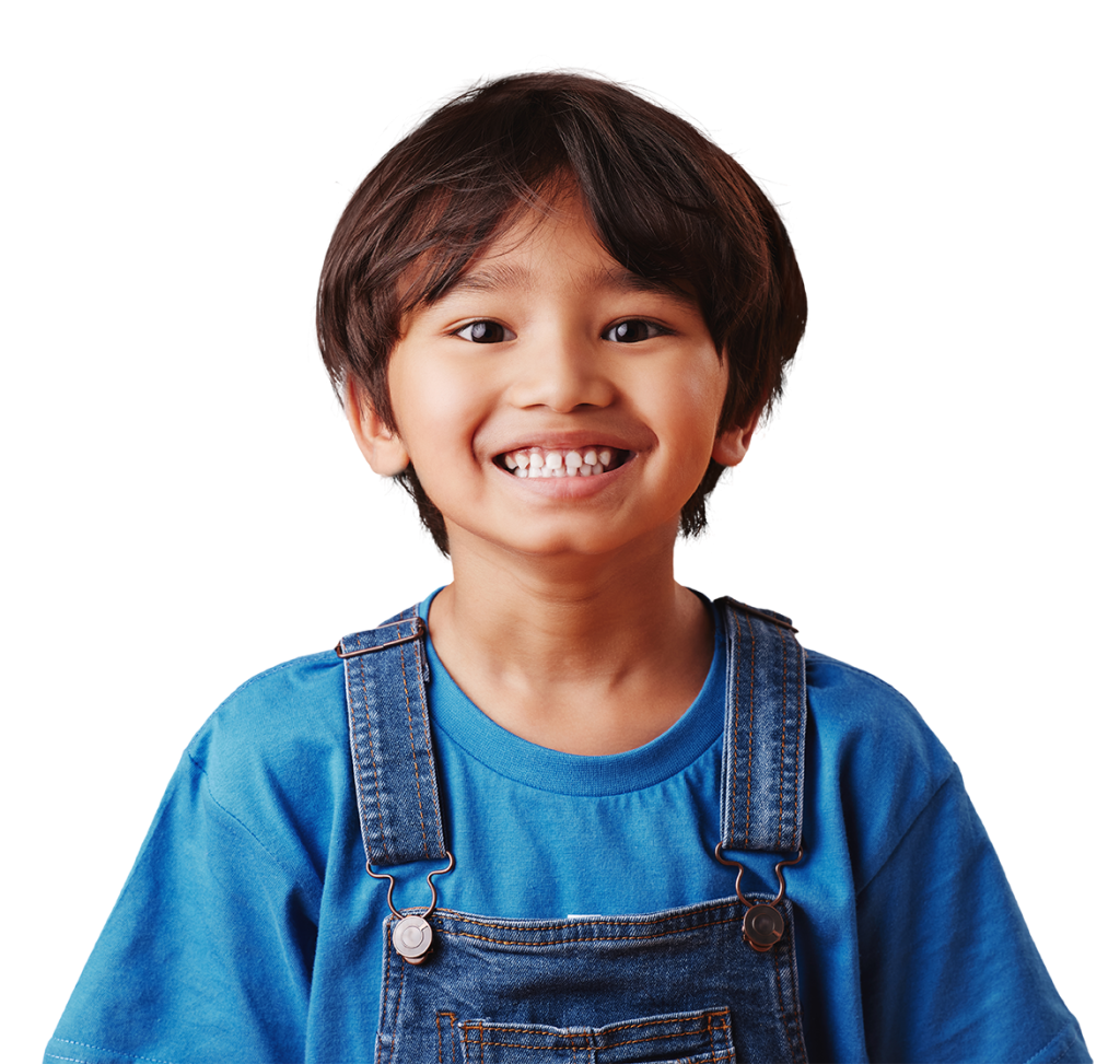 A smiling child with short, dark hair is pictured wearing a blue shirt and denim overalls. The background is white.