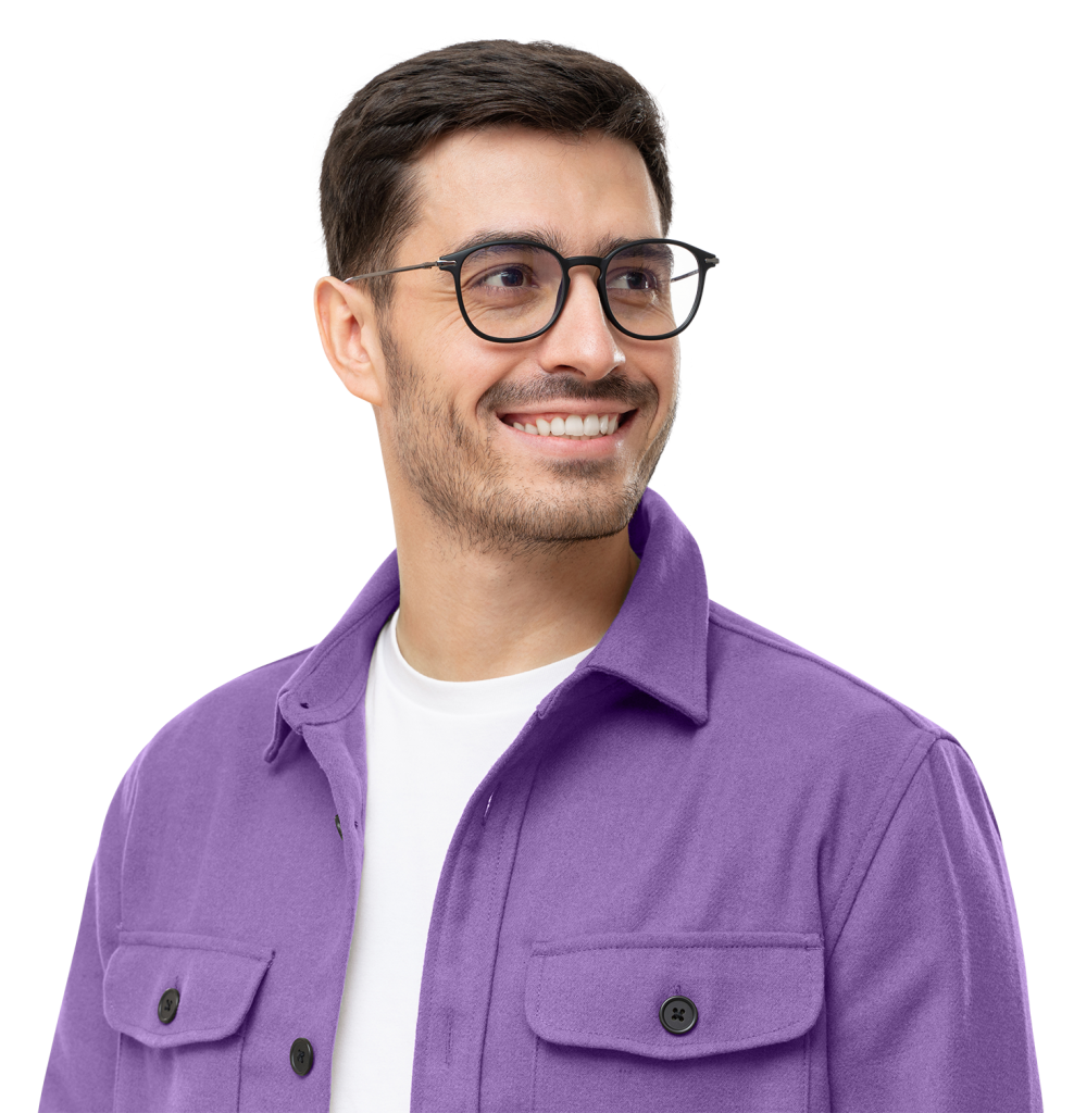 A man with short dark hair and a beard is smiling while wearing glasses, a white shirt, and a purple jacket. He is looking to his right. The background is white.